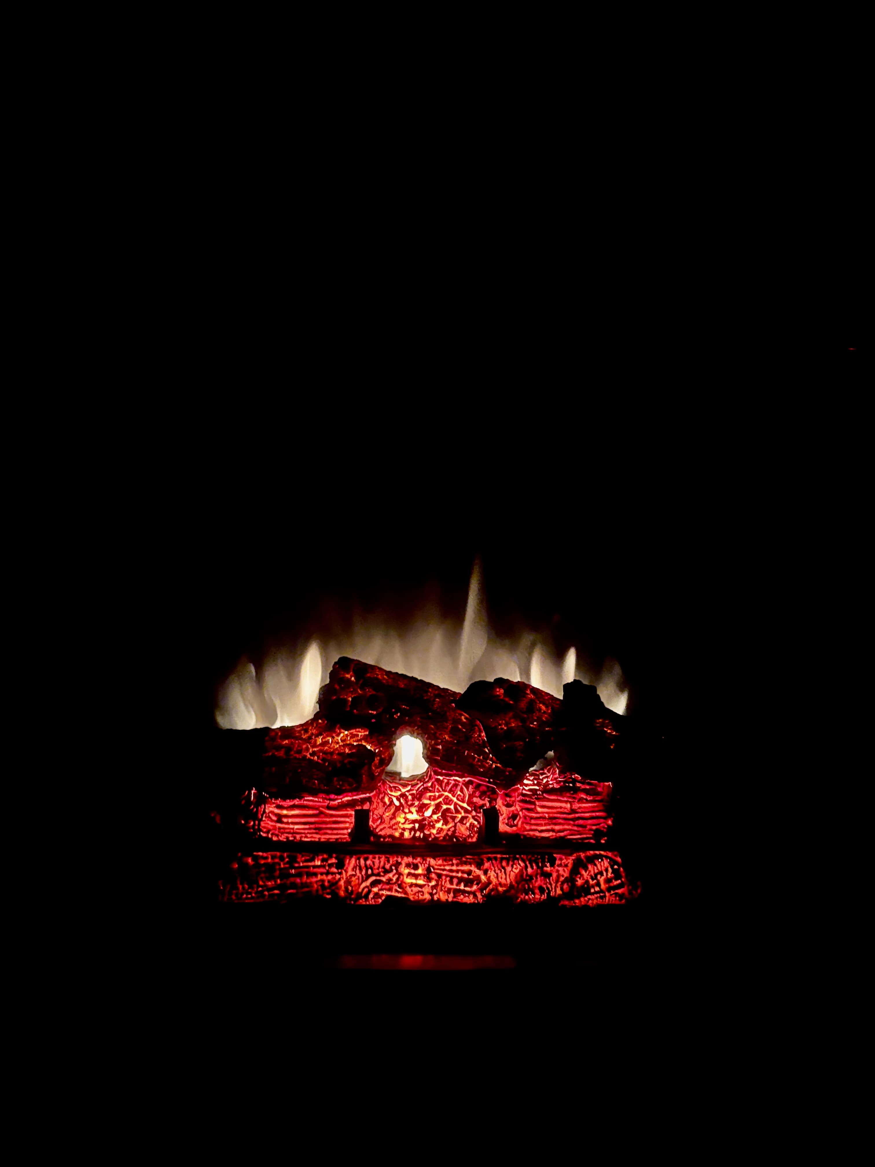 Fireplace with glowing red embers and flames