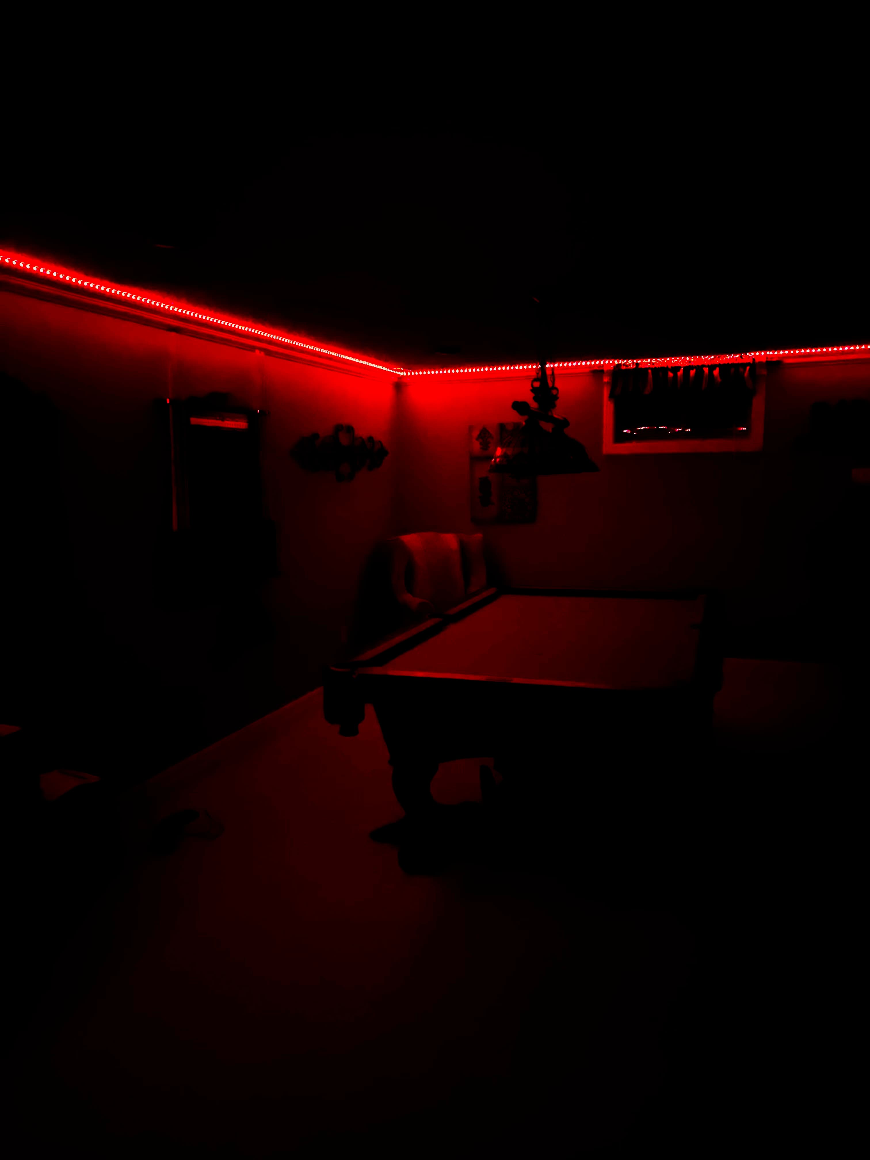 Atmospheric game room with dramatic red LED lighting